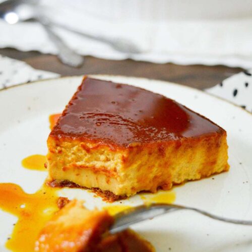 sliced pumpkin flan on a white plate