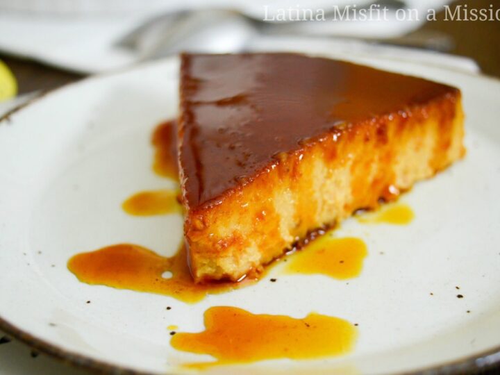 caramel drizzled over pumpkin flan on a white dish