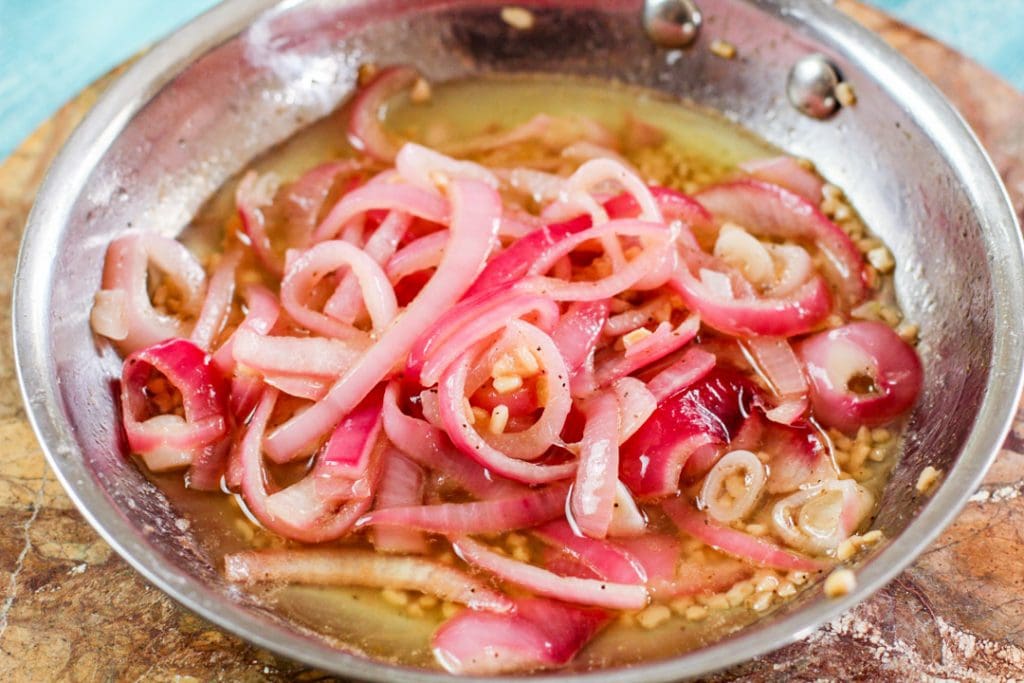 pickled onions in a steeless steel pan