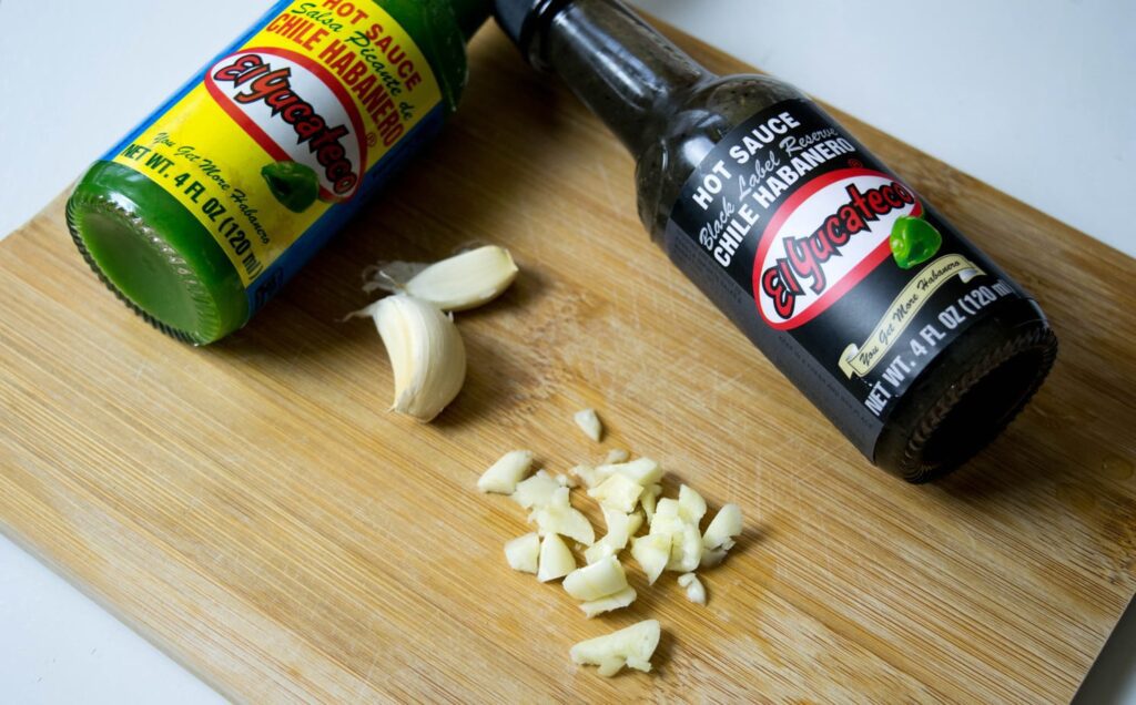 chopped garlic on a wooden board