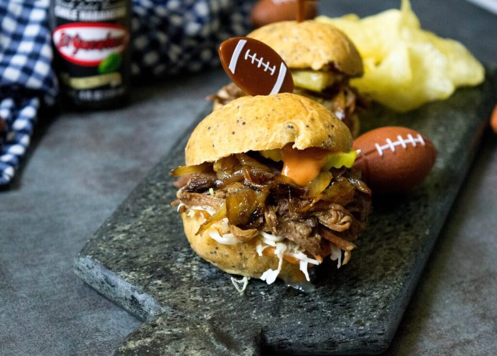 slow cooker Cuban BBQ beef sliders on a marble tray