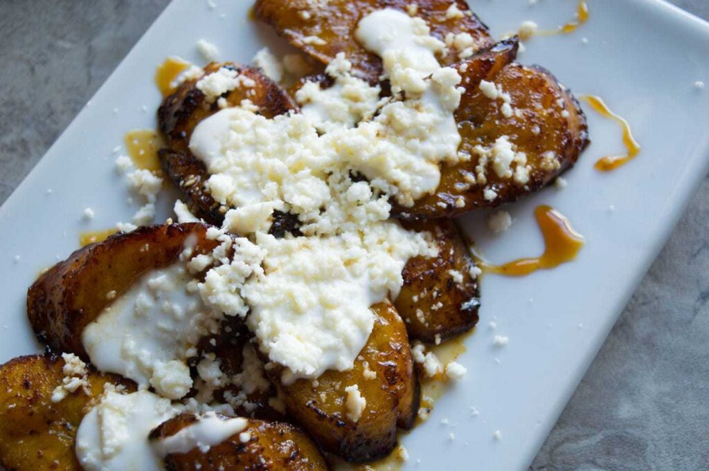 Mexican sweet orange honey plantains with cream and cheese.