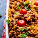Rustic Puerto Rican Beef and Sausage Pasta Bake in a pan garnished with cilantro