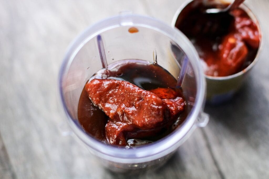 open blender with bbq sauce and chipotle peppers