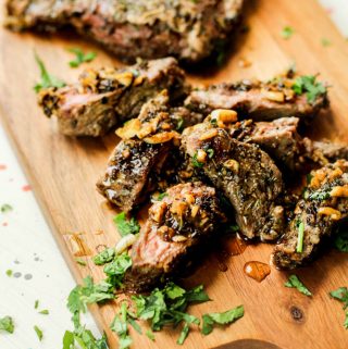 Garlic Cuban Steak on cutting board