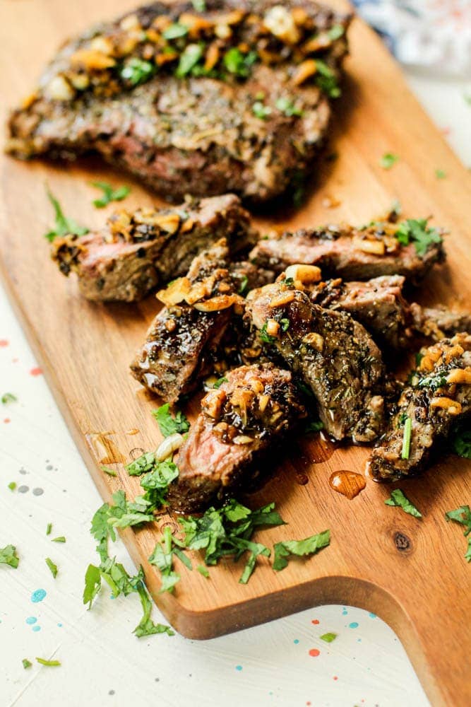 Garlic Cuban Steak on cutting board