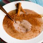 Cuban Chocolate Maizena (Natilla) on a white plate with a spoon
