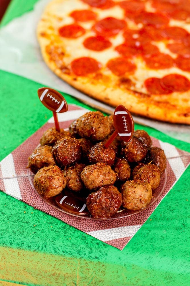 guava bbq meatballs on a football plate