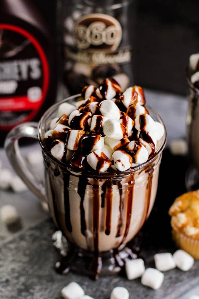 marshmallows covered by chocolate in a glass cup