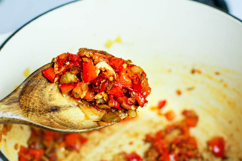 peppers and onions roasted in a white pot