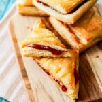 pastelitos de guayaba (guava pastry) on a wooden serving tray
