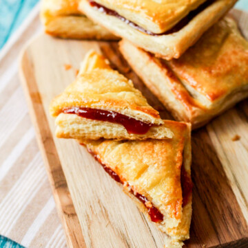 pastelitos de guayaba (guava pastry) on a wooden serving tray