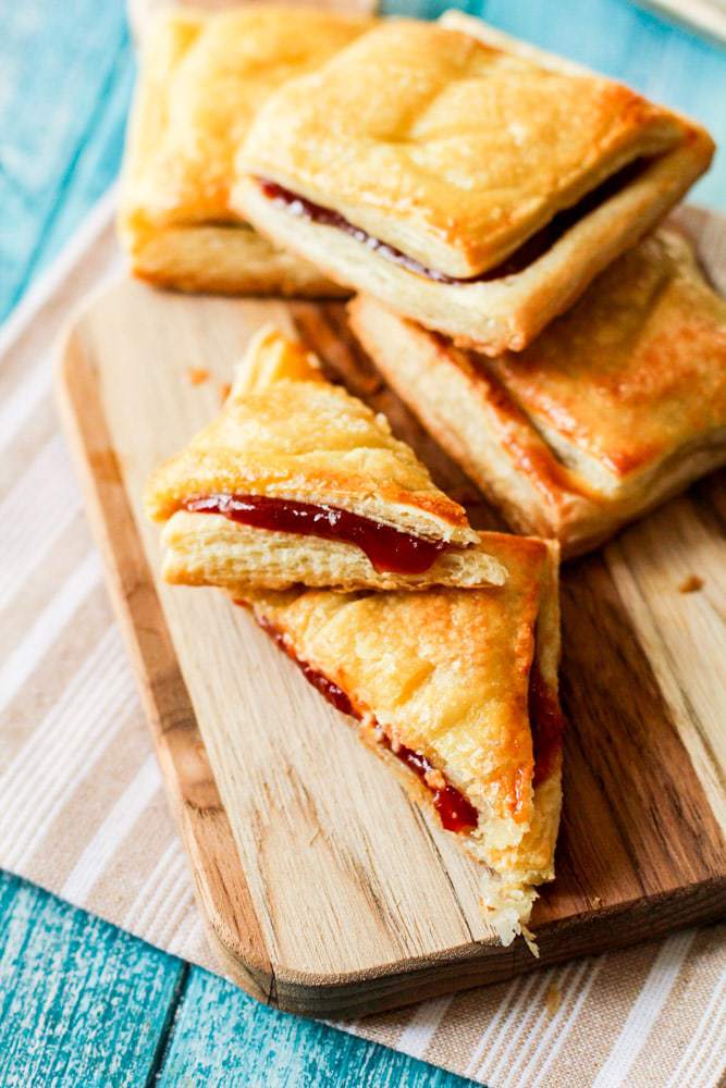 pastelitos de guayaba (guava pastry) on a wooden serving tray