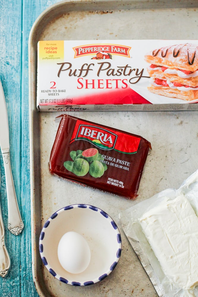 guava, puff pastry, cream cheese and an egg on a metal tray