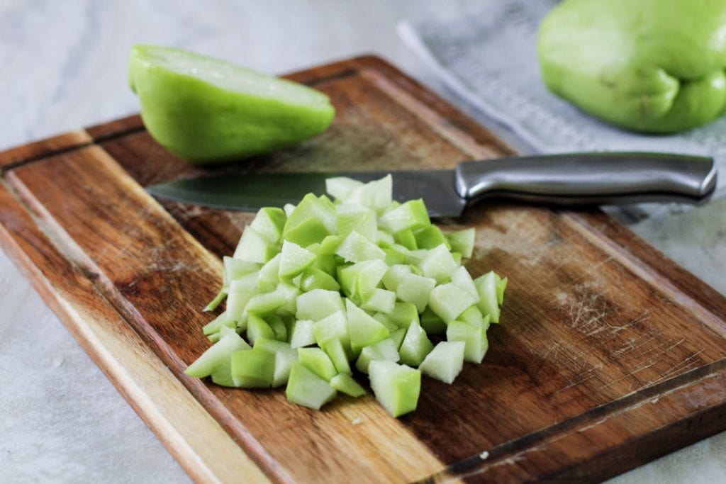 chopped chayote on a cutting board