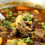 Beef stew and potatoes in a pot