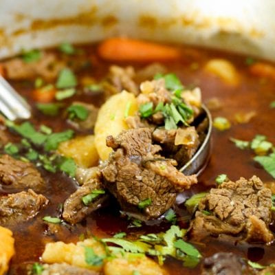 Beef stew and potatoes in a pot