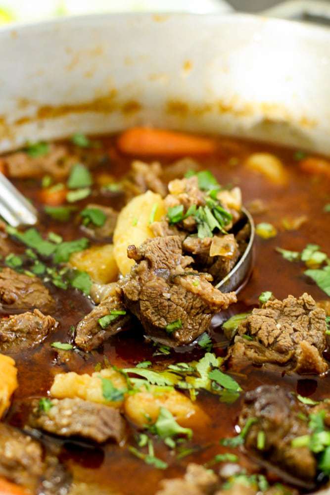 Beef stew and potatoes in a pot