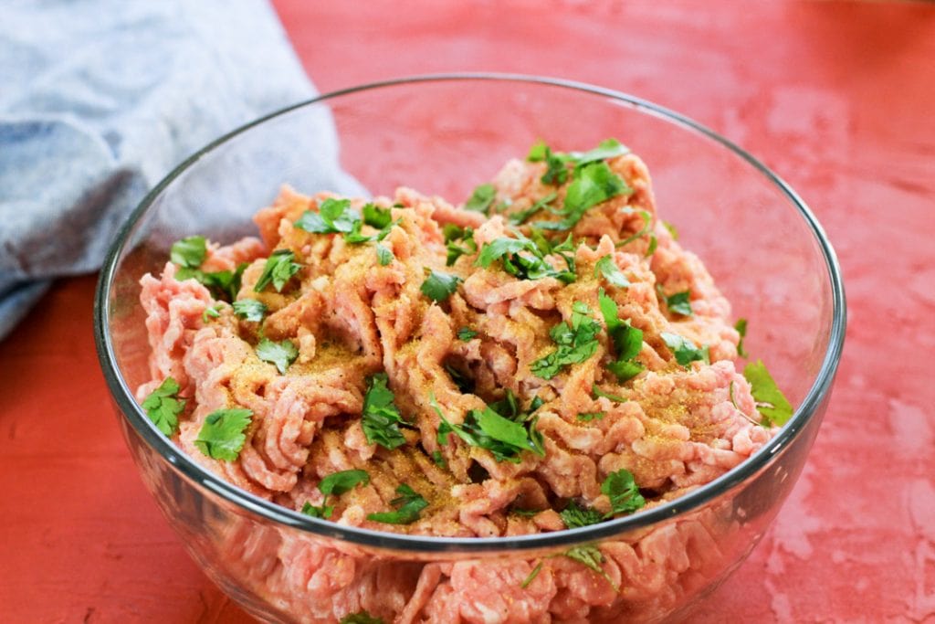 ground pork in a glass bowl