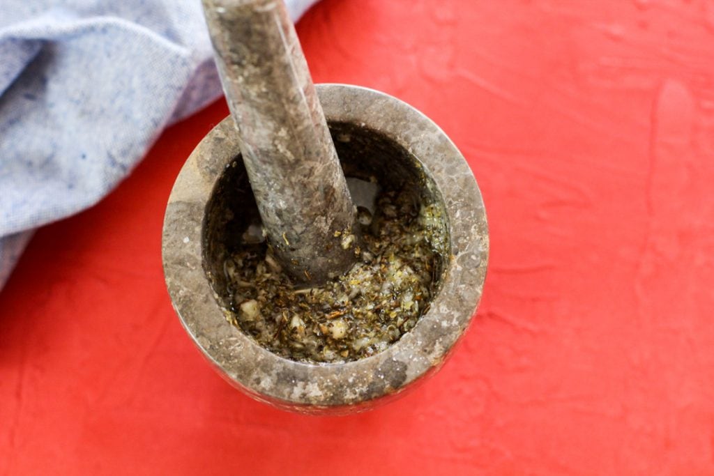 pilon filled with mojo marinade on a red background