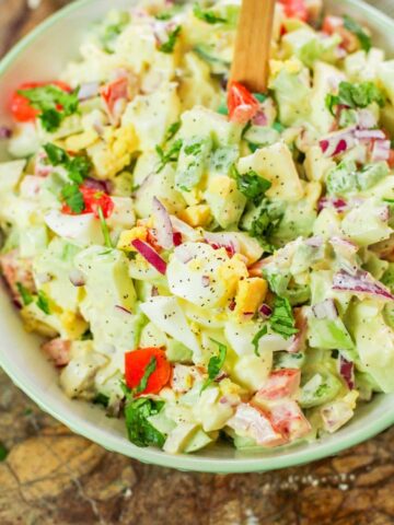 chayote egg salad in a white bowl