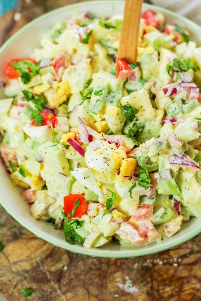 chayote egg salad in a white bowl