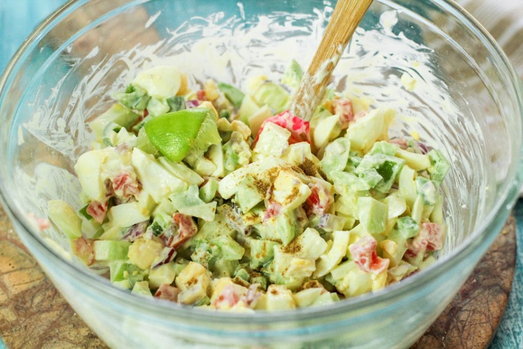 chayote egg salad in a glass bowl