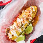loaded corn in a red bowl