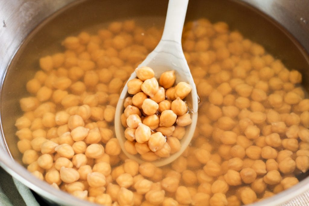 dried chickepeas in a bowl with water