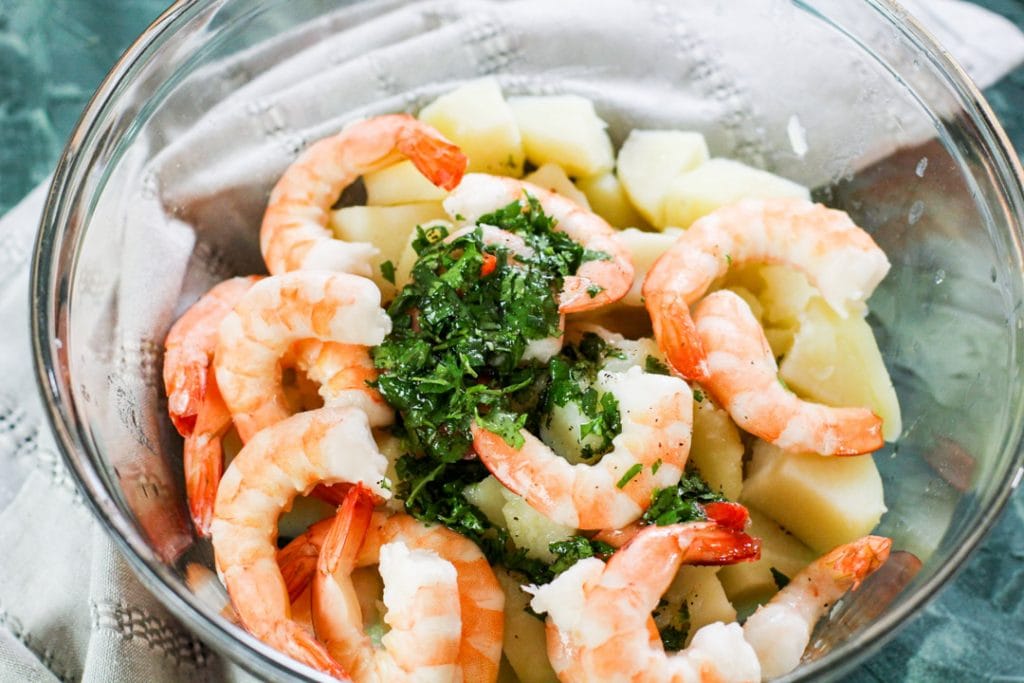 shrimp potatoes and mojo in glass bowl