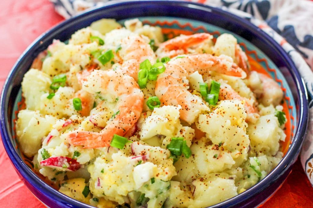 shrimp potato salad in a blue bowl