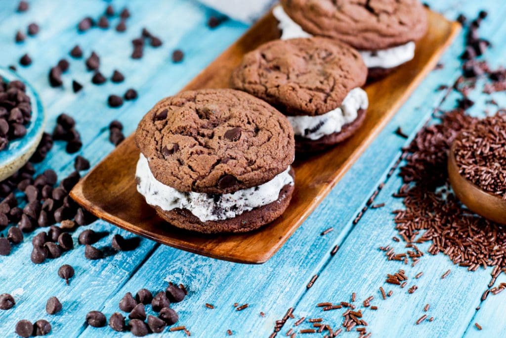 ice cream sandwiches on a wooden serving plate