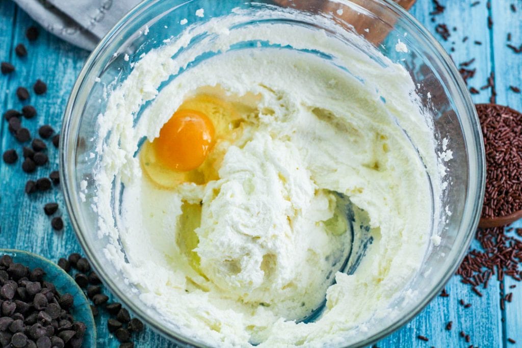 creamed sugar with egg in a glass bowl