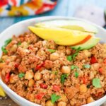 mango turkey picadillo in a white bowl