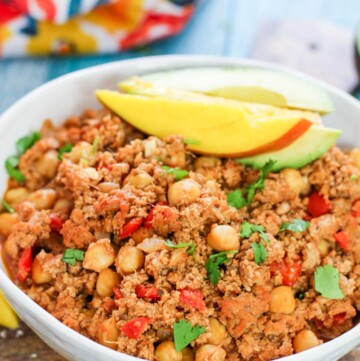 mango turkey picadillo in a white bowl
