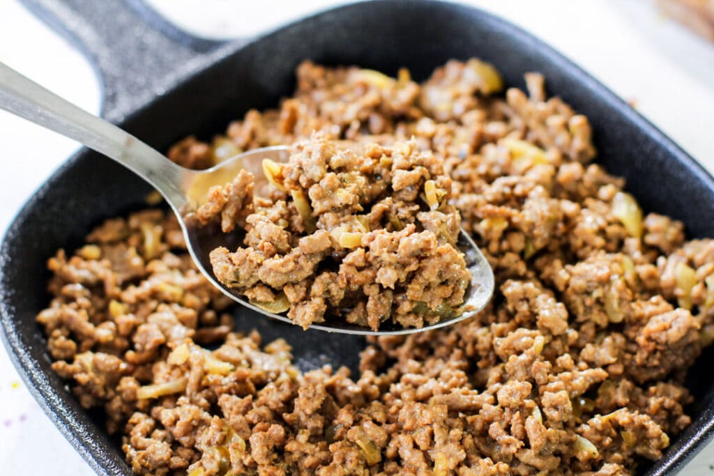 picadillo mixture with a metal spoon