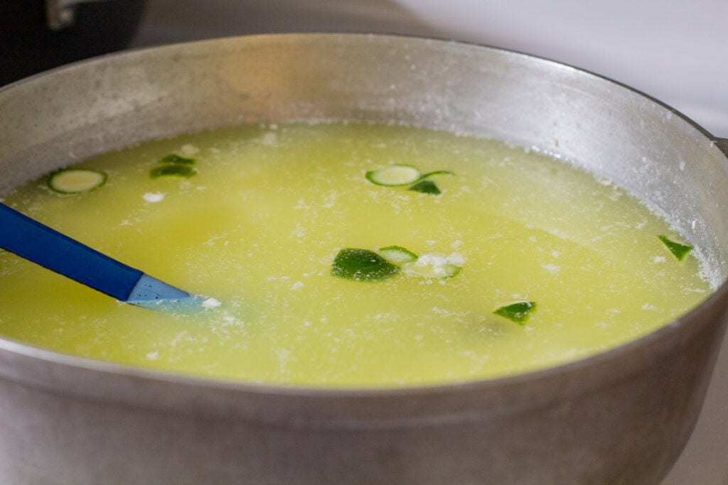 liquid in a large pot with lime chunks floating