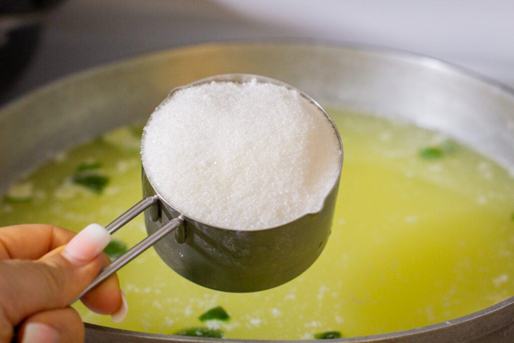 white sugar in a measuring cup