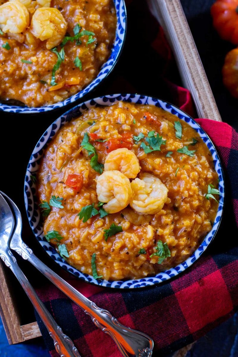 rice and shrimp stew in a blue plate