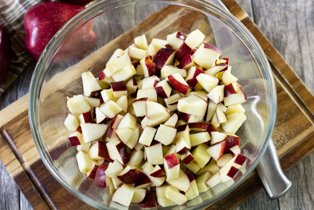 chopped apples in a glass bowl