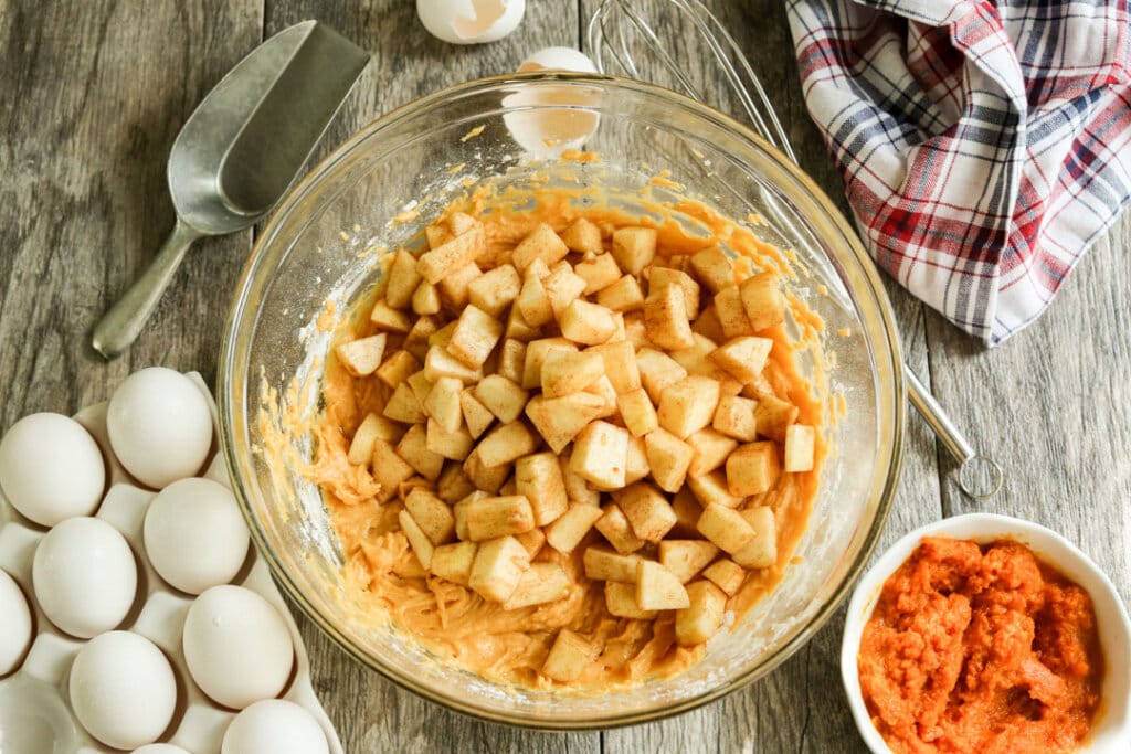 raw chopped apple in a mixing bowl