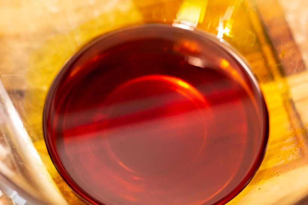 orange achiote oil in glass bowl