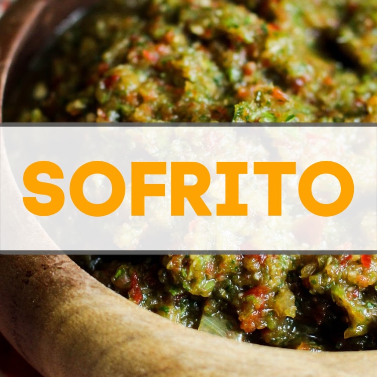 A wooden bowl filled with sofrito.