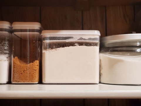 dry goods in containers on shelf