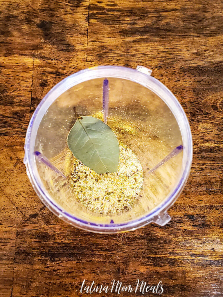 bay leaf and seasonings in a blender cup