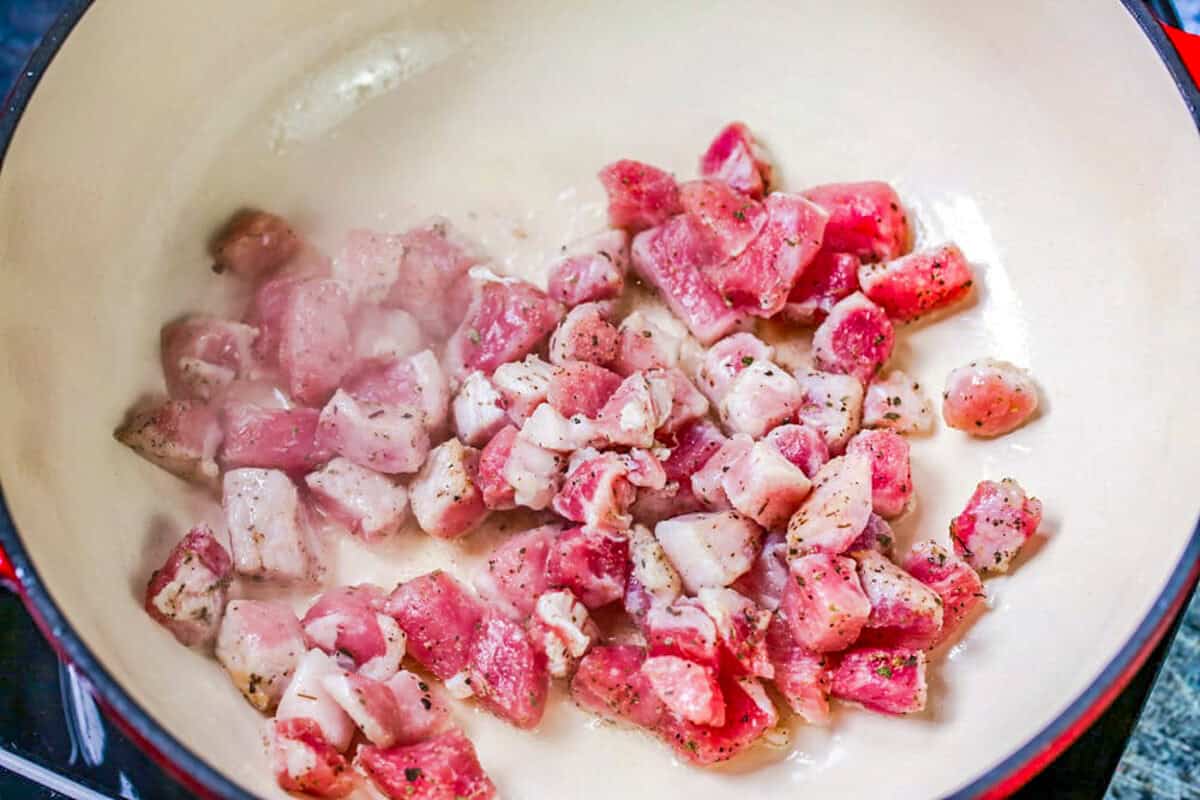 Pork cooking in pan.