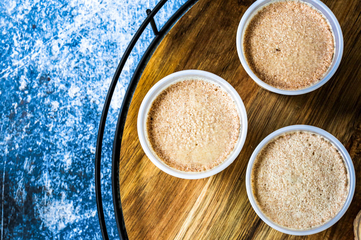 Overhead shot of three frozen limbers on a wooden round serving tray.