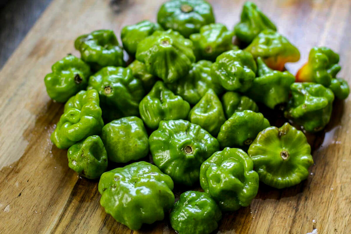 A bunch of aji dulce on a cutting board
