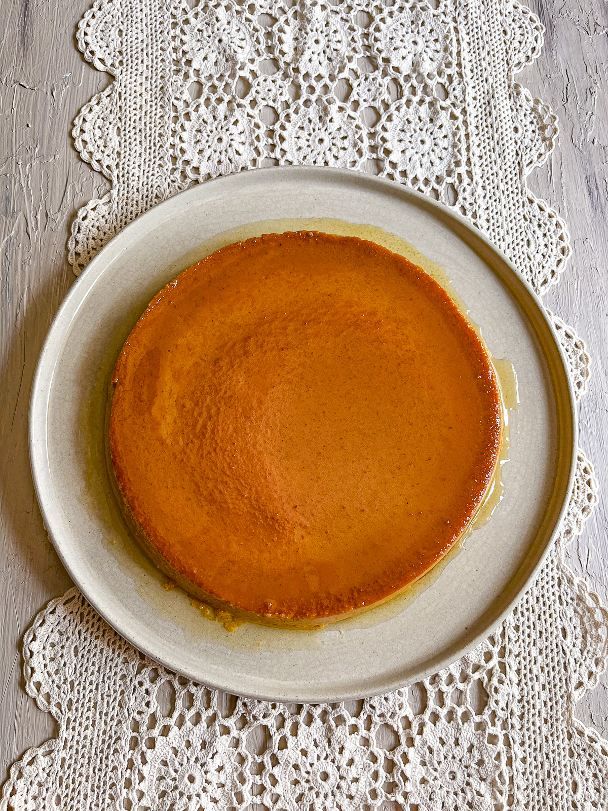 Creamy pumpkin flan on a white plate